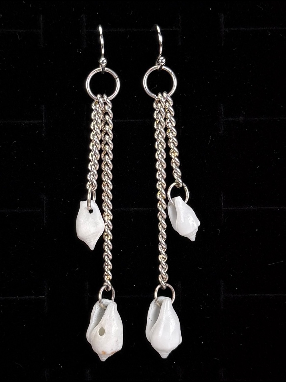 Lightweight, long Silvertone chain, white shell charm accent pierced earrings
